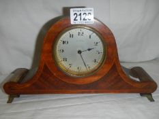 An Edwardian inlaid mantel clock.