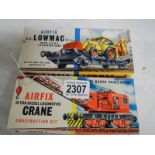 A boxed Airfix crane and a boxed excavator.