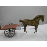 An early 20th century toy pull along horse and cart, 13" long.