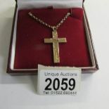 A rose gold cross dated Chester 1932, chased gold work to front with attached 9ct gold chain, 9.
