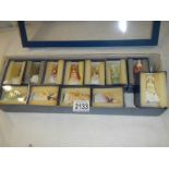 A set of 12 fine English bone china miniature figures, all signed.