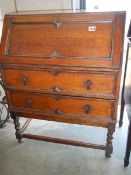 An oak drop front bureau.