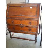 An oak drop front bureau.