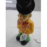 A Vintage clockwork toy clown.