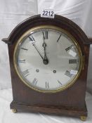 A 'Whitaker, Oldham' bracket clock with silvered dial.
