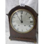 A 'Whitaker, Oldham' bracket clock with silvered dial.