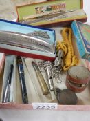 A mixed lot including 2 harmonica's, whistle etc.
