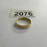 A 22 ct gold wedding band, size M. 2 grams.