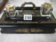An old inkstand with 2 inkwells.