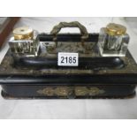 An old inkstand with 2 inkwells.