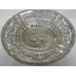 A foreign silver embossed dish, approximately 308 grams.