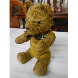 A vintage hump back teddy bear.