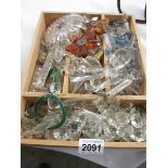 A large tray of crystal and glass chandelier droppers.