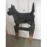 A Victorian cast iron shoe scraper in the form of a dog.