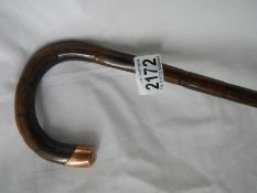 A walking stick with 9ct gold mount. ****Condition report**** Total L 105cm.