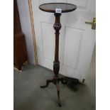 A mahogany mid 20th century torchere / plant stand.