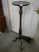 A mahogany mid 20th century torchere / plant stand.