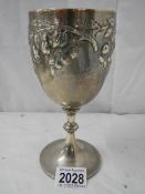 A good hall marked silver embossed chalice, 240 grams.