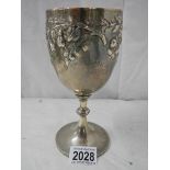 A good hall marked silver embossed chalice, 240 grams.