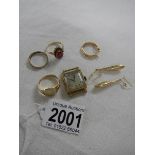 A mixed lot of gold including rings, watch head etc.
