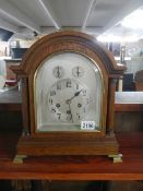 A good early 20th century oak mantel clock in full working order.