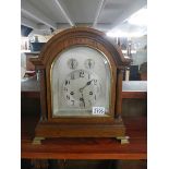 A good early 20th century oak mantel clock in full working order.