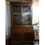 A Victorian mahogany astragal glazed bookcase.