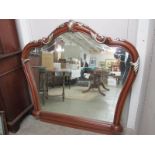 A large mahogany overmantel mirror.