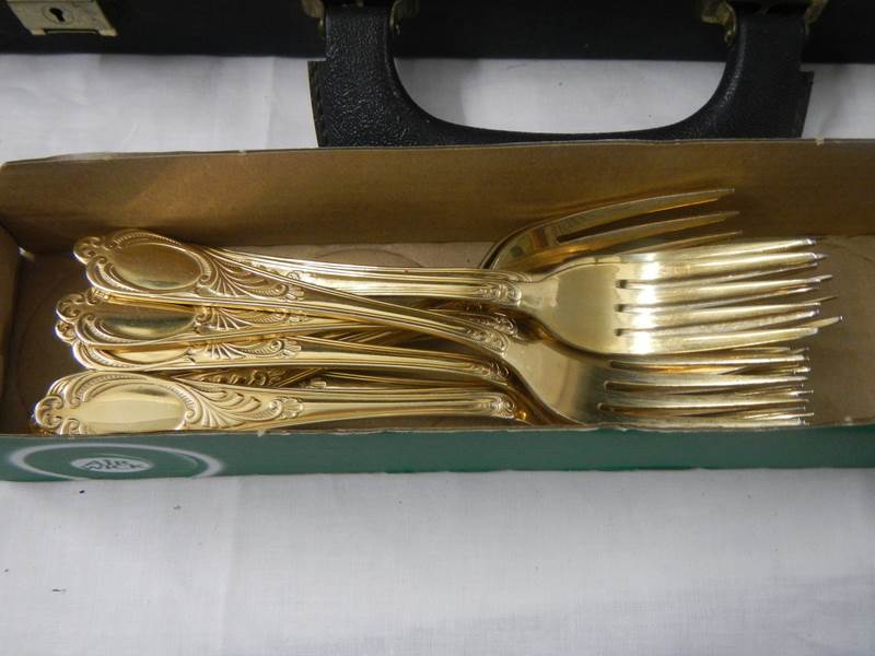 A gilded 12 place setting cutlery set by Besteoke Solingen, Germany. - Image 3 of 7