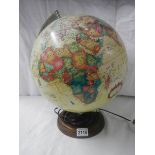 An illuminating world globe, 15" tall.