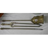 A set of Victorian reeded brass fire irons, 25" long.