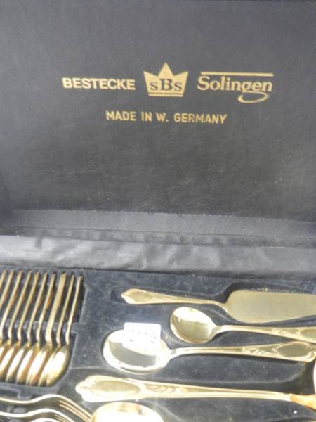 A gilded 12 place setting cutlery set by Besteoke Solingen, Germany. - Image 7 of 7