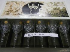 A boxed set of 6 Mystique Crystal D'arques quarter ounce wine glasses, made in France 1995.