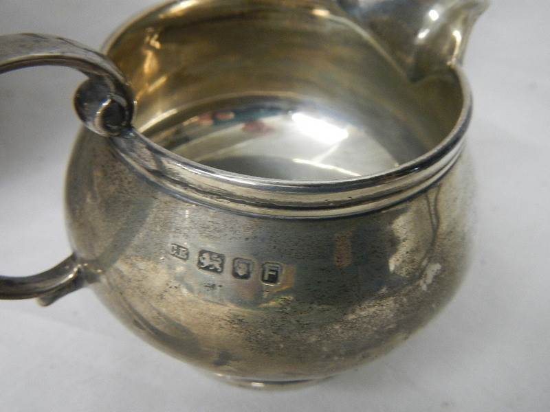 A 3 piece hall marked silver tea set and sugar nips, 684 grams. - Image 3 of 4