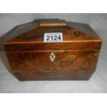 A figured mahogany caddy shaped box.