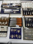 A mixed lot of cased silver plate cutlery, spoons etc.