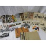A mixed lot of postcards, photographs and an unused autograph book.