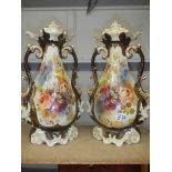 A pair of Staffordshire vases, some crazing and one handle has repair.