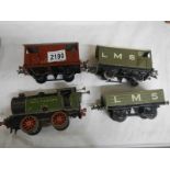 A Hornby '0' gauge loco and 3 rolling stock.