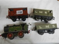 A Hornby '0' gauge loco and 3 rolling stock.