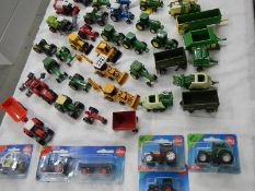 In excess of 40 die cast farm vehicles etc.