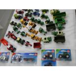 In excess of 40 die cast farm vehicles etc.