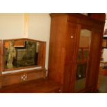 An oak wardrobe and dressing table.