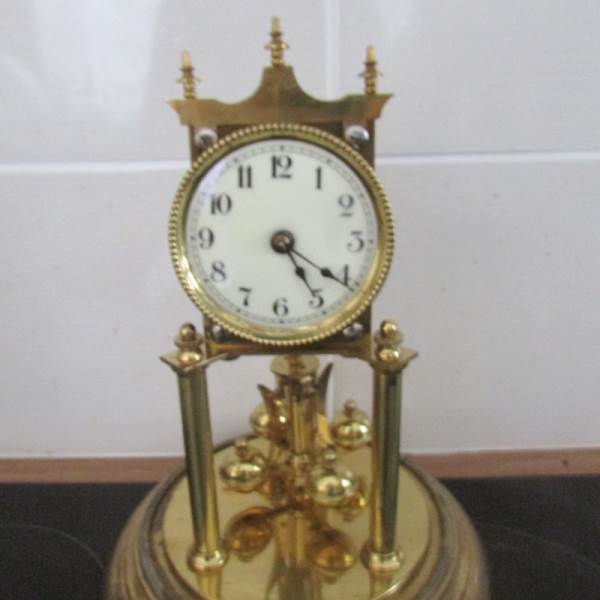 A good quality anniversary clock under glass dome. - Image 2 of 4