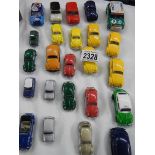 approximately 24 die cast cars including Volkswagen Beetles and Mini's etc.