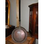 A Victorian copper warming pan.