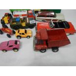 A mixed lot of old tin and plastic toys.