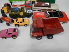 A mixed lot of old tin and plastic toys.