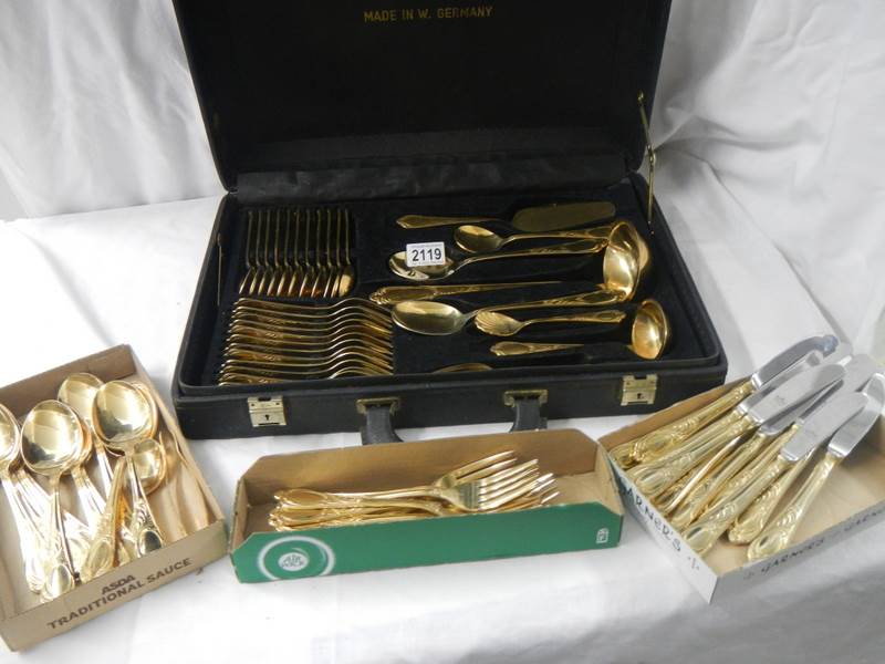 A gilded 12 place setting cutlery set by Besteoke Solingen, Germany.