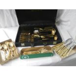 A gilded 12 place setting cutlery set by Besteoke Solingen, Germany.